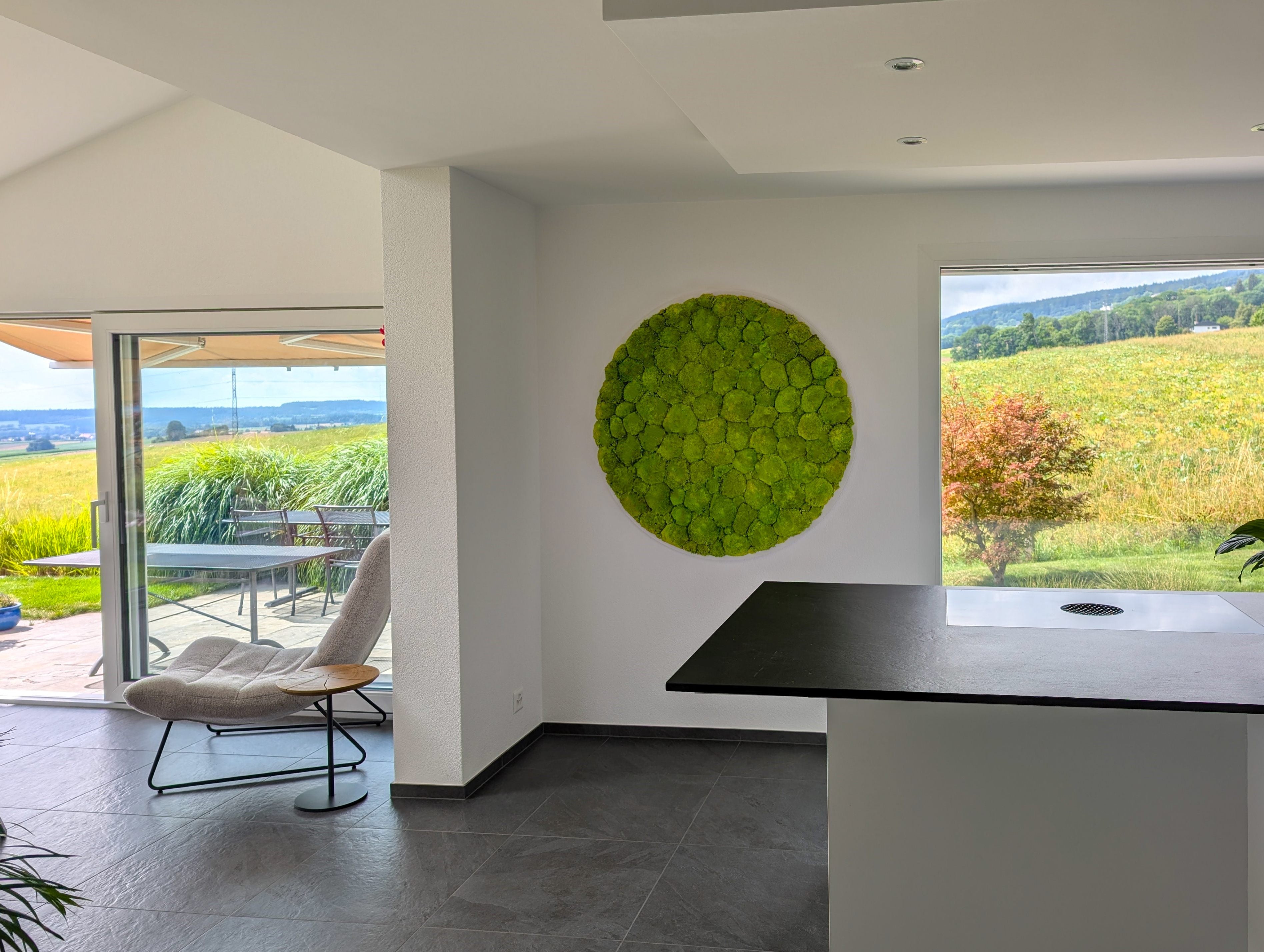 Rundes Islandmoosbild in schönem Haus